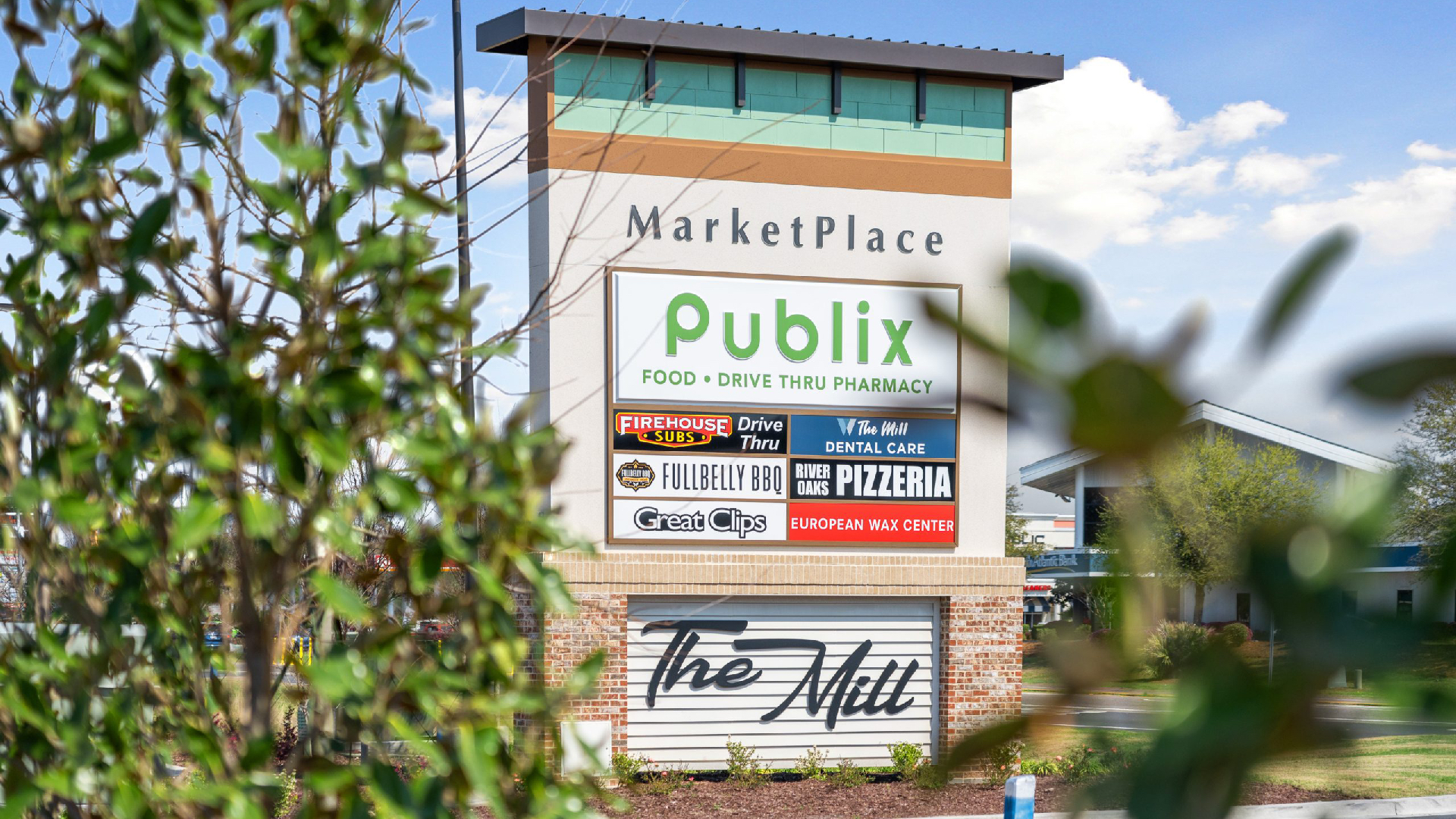 A Front Exterior Shot of the Retail Property Market Place with Signs for Business